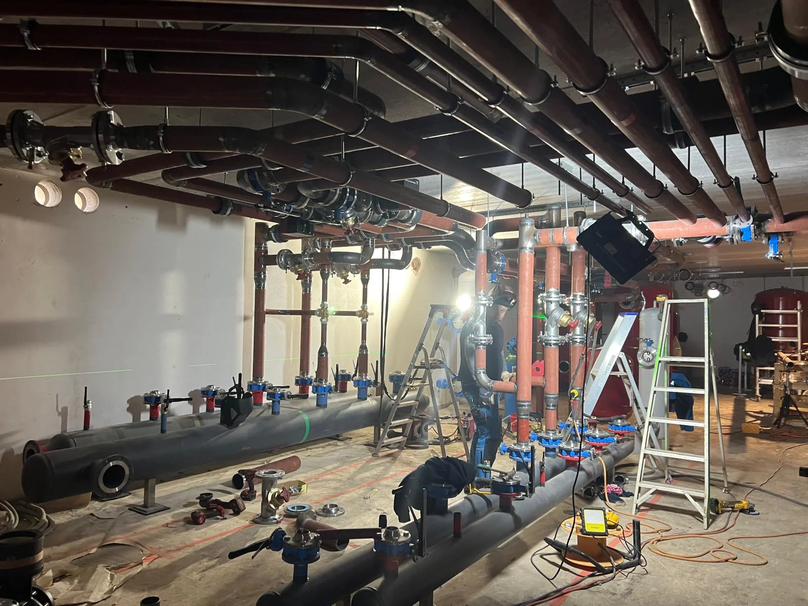 Industrial heating manifold with chrome valves and pipework — plumbing and HVAC installation