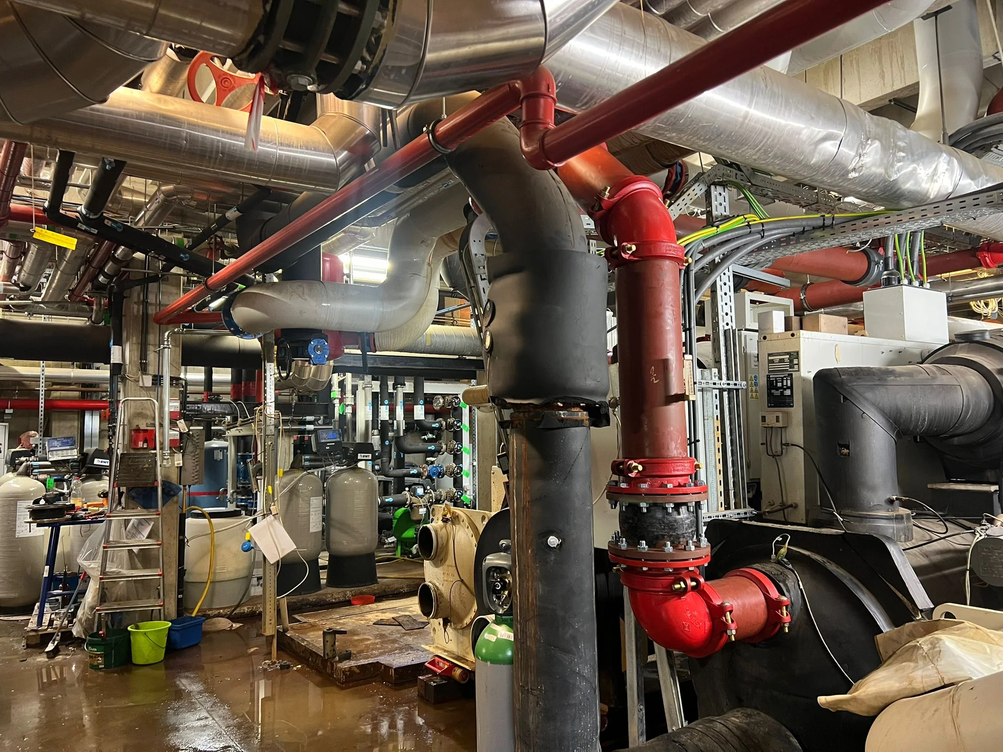 Galvanized-steel ventilation ducts installed in industrial building ceiling cavity